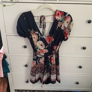 Multi patterned navy blue romper size small!